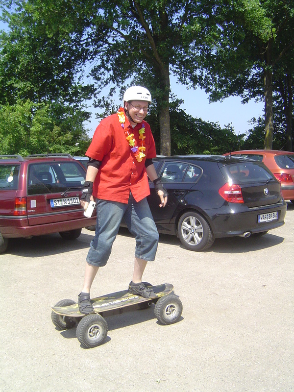 Beetle on electric skateboard