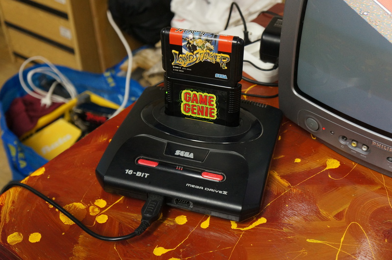 Sega Mega Drive II with Game genie